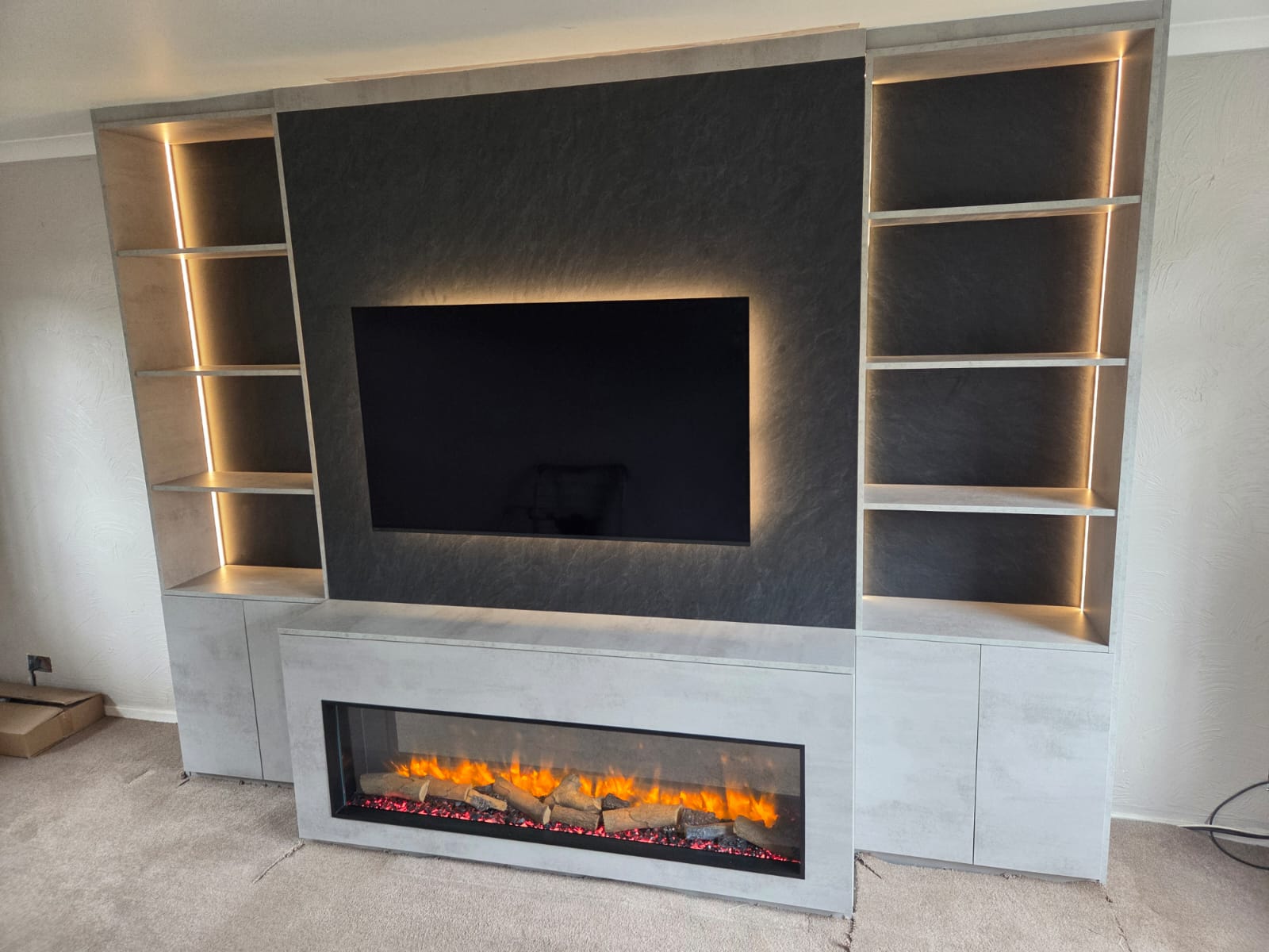 Media wall with electric fireplace on display in showroom